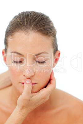 Concentrated woman having a head massage