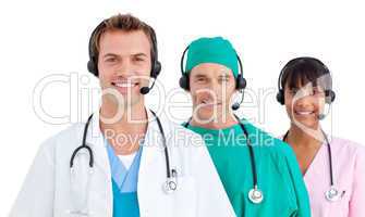 Smiling medical team using headsets