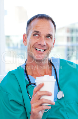 Mature doctor having a break