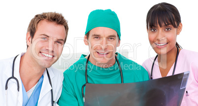 Portrait of medical team looking at X-ray