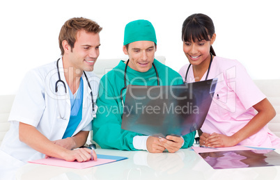 Positive medical team looking at X-ray