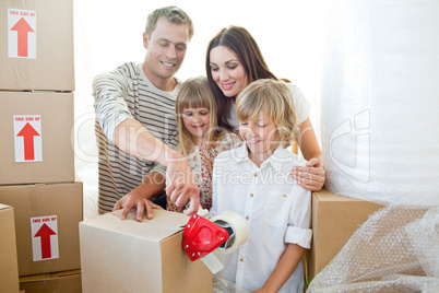 Merry family packing boxes