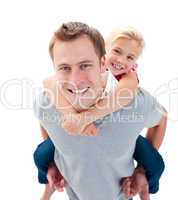 Smiling father giving his daughter piggyback ride