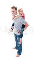 Portrait of  father giving his daughter piggyback ride