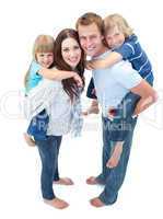 Loving family enjoying piggyback ride