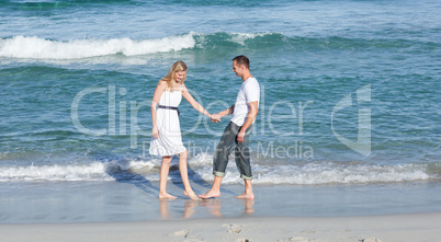 lovers having fun at the seaside