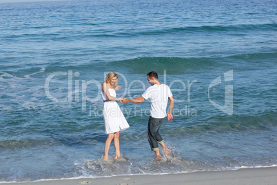 lovers having fun at the seaside