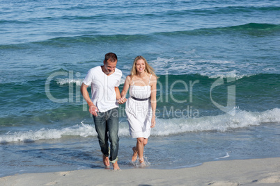 lovers walking at the seaside