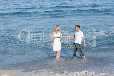 lovers having fun at the seaside