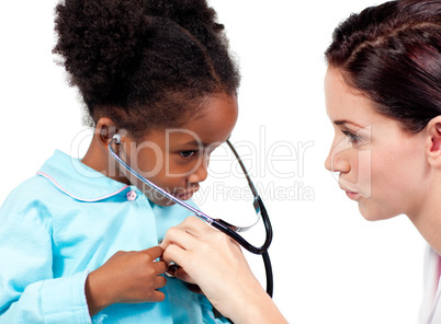 Cute little girl and her doctor playing with a stethoscope