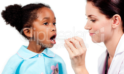Female doctor taking little girl's temperature