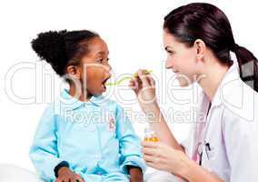 Female doctor giving medicine to her patient