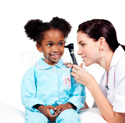 Concentrated doctor checking her patient's ears