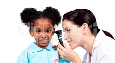Smiling doctor checking her patient's ears