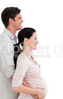 Portrait of a cheerful pregnant woman with her husband