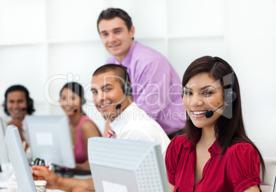 Positive business people with headset on working