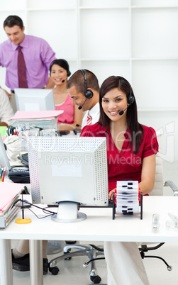 Multi-ethnic business people with headset on working