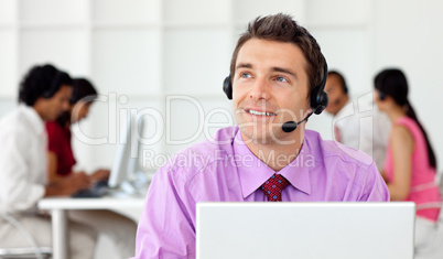 Smiling businessman talking on headset