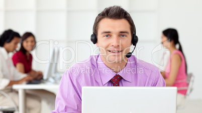 Assertive businessman using headset