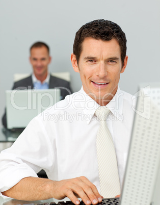 Confident businessman working at his computer