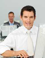 Confident businessman working at his computer