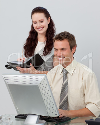 Assertive manager checking her employee's work
