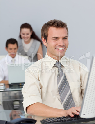 Assertive businessman working at his computer