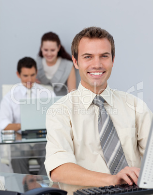 Attractive businessman working at his computer Attractive businessman working at his computer