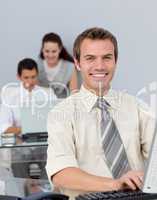 Attractive businessman working at his computer