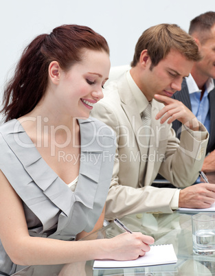 Attractive businesswoman making notes