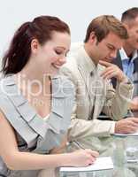 Attractive businesswoman making notes