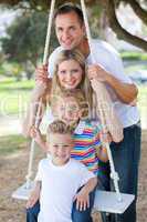 Happy family swinging