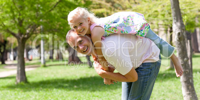 Happy little girl having fun with her father