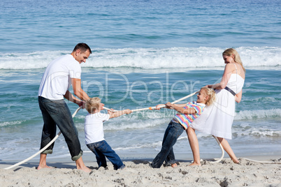 Excited family playing tug of war