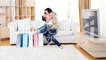 Affectionate mother and her daughter at home after shopping