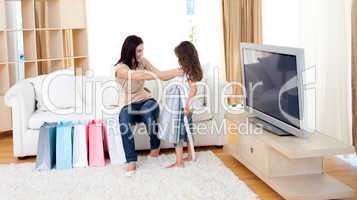 Mother and her daughter at home after shopping