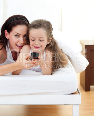 Attractive mother and her daughter having fun