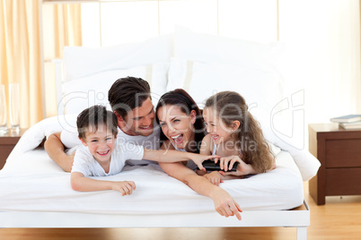 Siblings with their parents having fun