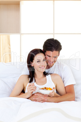 Smiling couple having breakfast