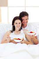 Affectionate couple having breakfast