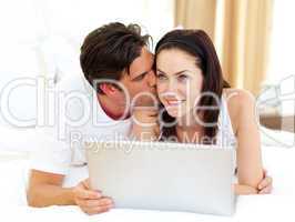 Lovers using laptop