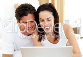 Romantic couple using laptop