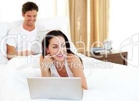 Charismatic woman using laptop