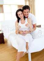 Jolly couple finding out results of a pregnancy test