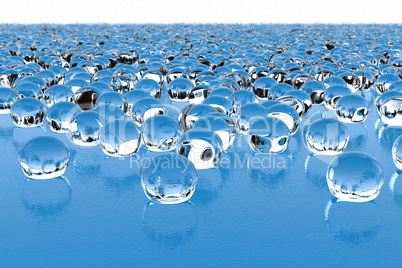Thousands of glass drops on a wavy surface