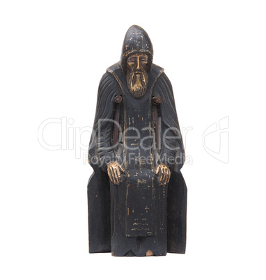 Photo of the wooden statuette against the white