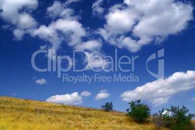 Hillside and sky with clouds