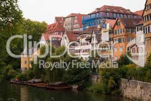 Neckar river with boats and Tübingen embankment, Baden Württemberg, Germany