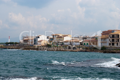 Lighthouse cape under heavy clouds, Majorca, Spain