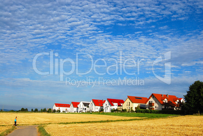 Tranquil landscape - hay fields and house range